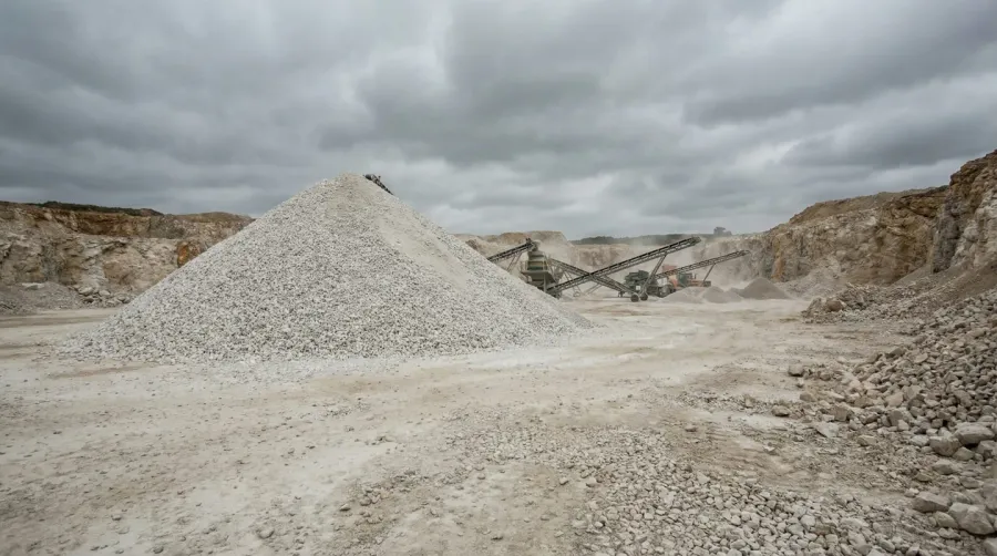 White limestone aggregate pile at quarry site