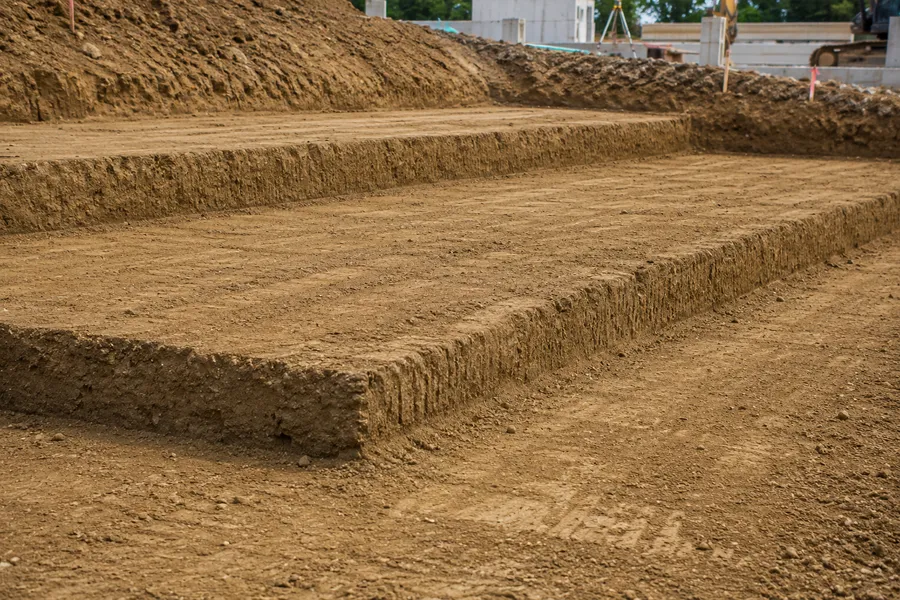 Fill dirt graded away from a house foundation