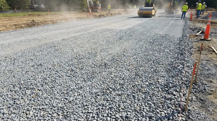 #57 stone being used in a driveway installation, showing the medium-sized angular pieces and good drainage properties