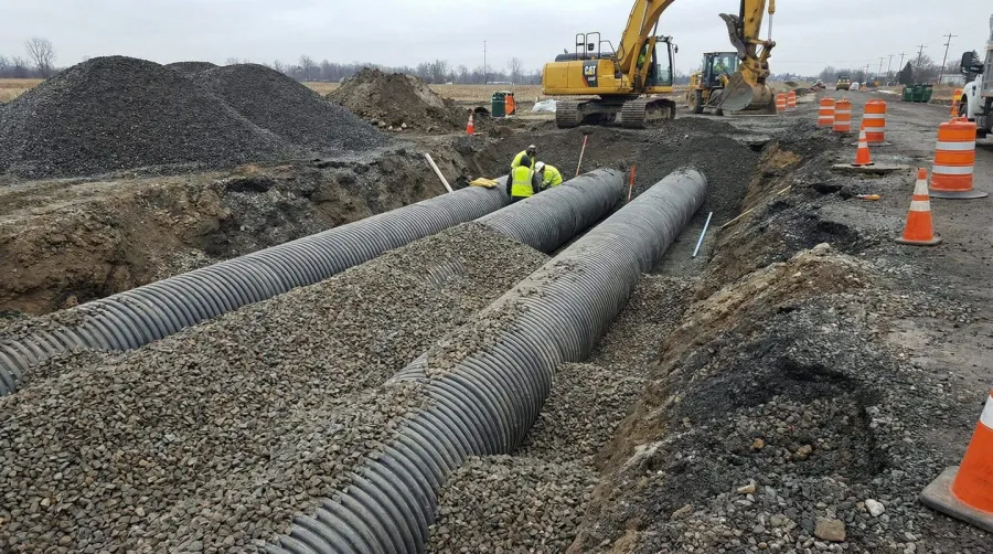 Drainage pipes with aggregate base at construction site