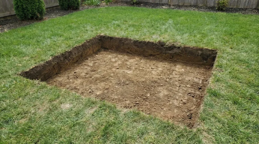 Step-by-step gravel installation process for deck foundation, showing layers of gravel being compacted