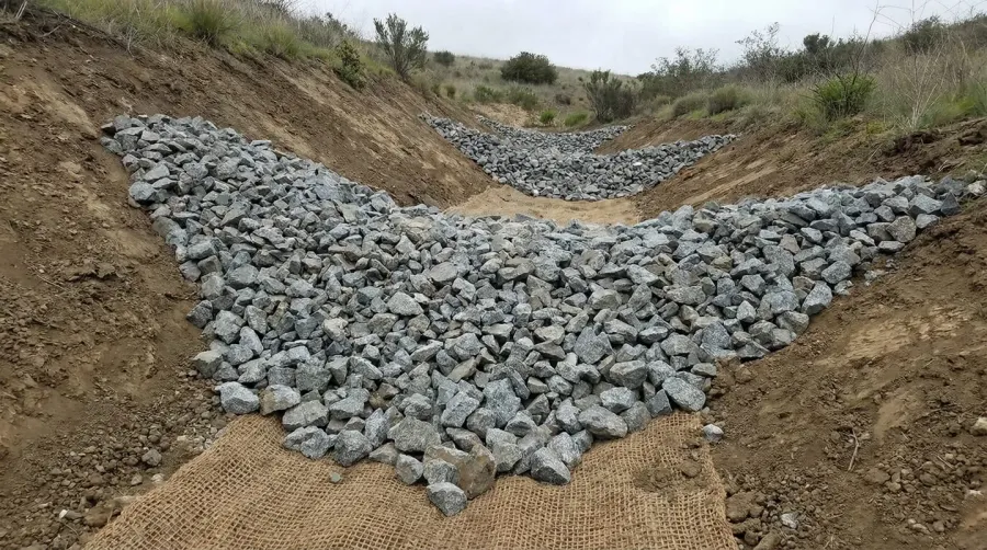 Crushed granite stones used in erosion control structure project