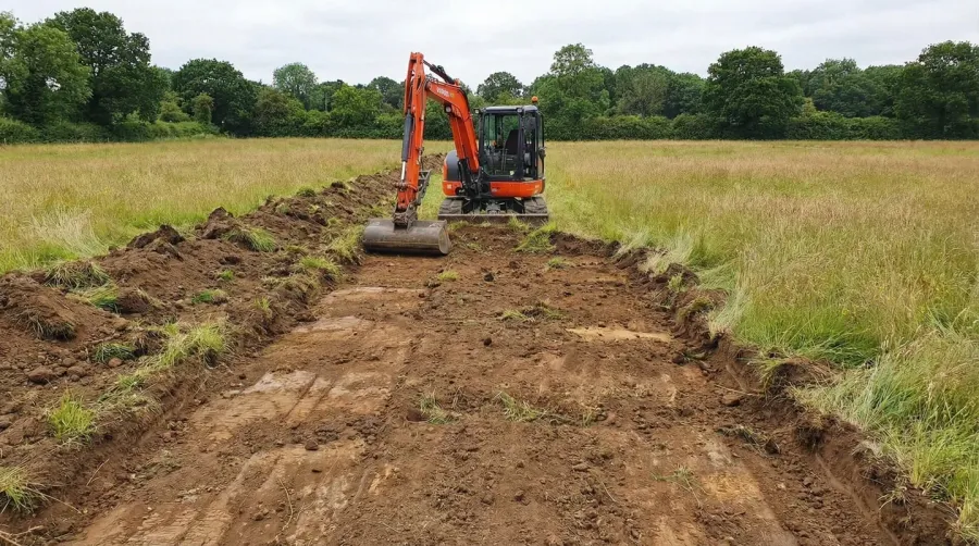 Step-by-step installation process for gravel driveway from preparation to compaction