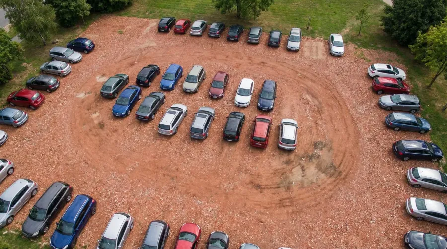 Brick chip parking lot aerial view showing textured surface with cars parked