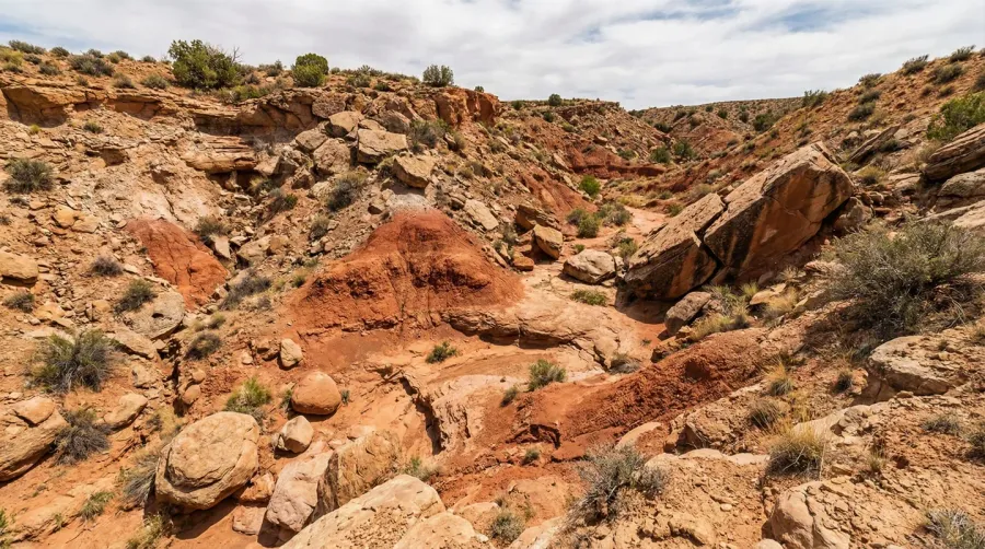 Geological formation process of red clay with weathered rocks