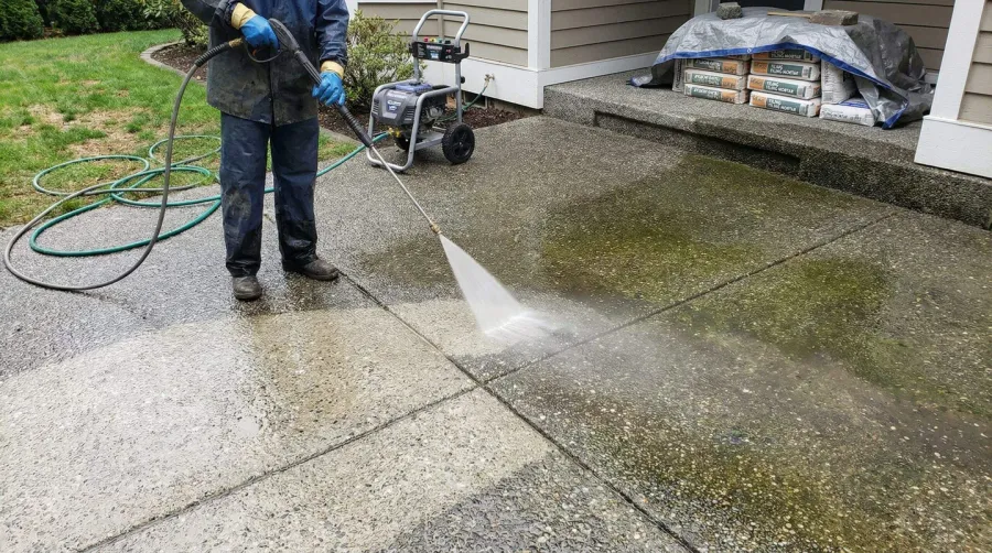 Pressure washing aggregate concrete surface preparation