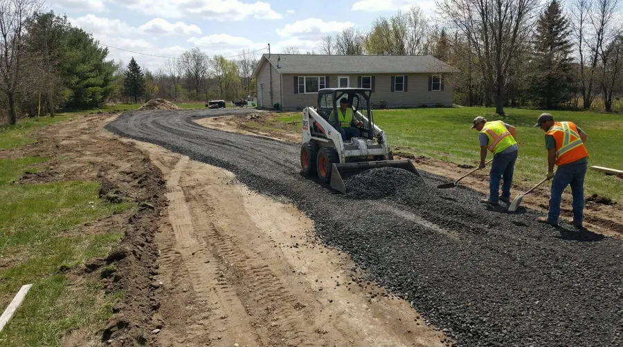 Bank run gravel driveway installation in progress