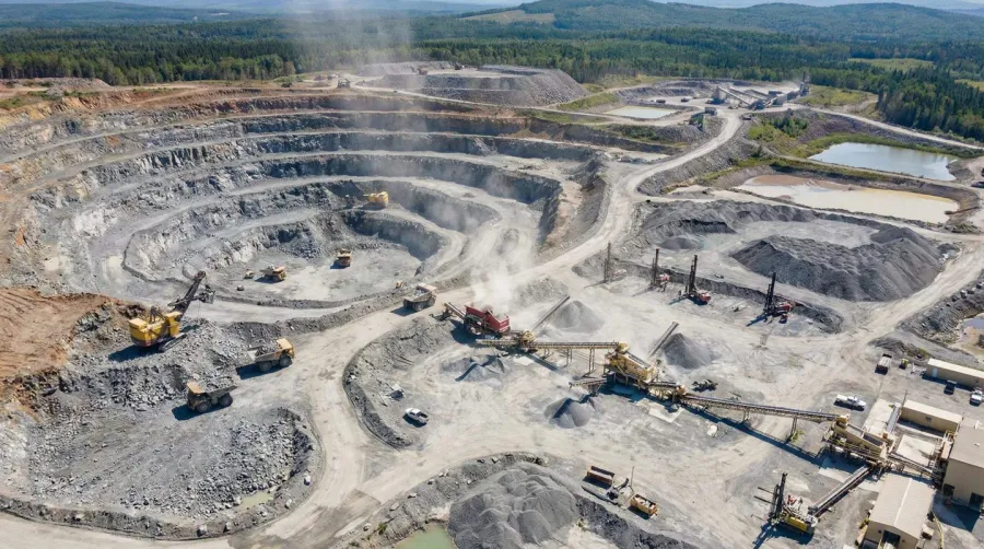 Aerial View Of Active Quarry With Equipment And Extraction Operations
