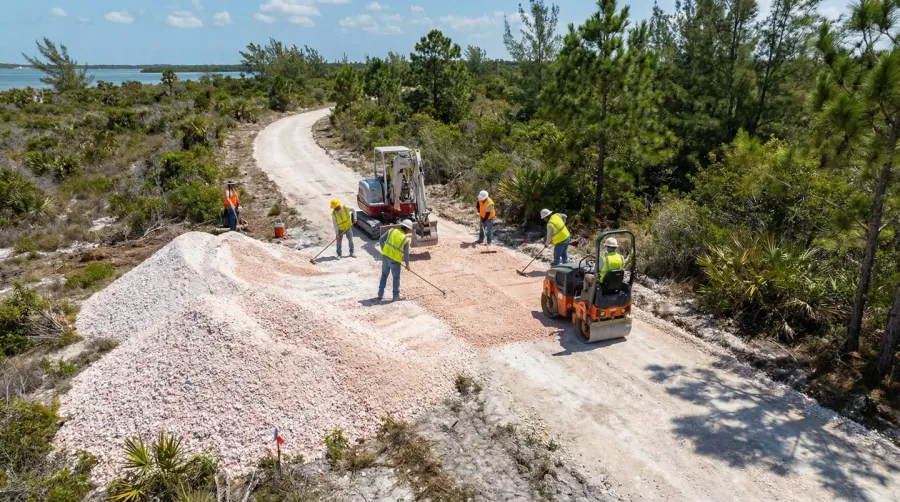 Bike path construction site showing crushed coral installation process