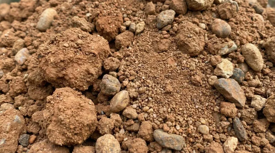 Close-up of quality fill dirt showing sand, clay, and rock composition