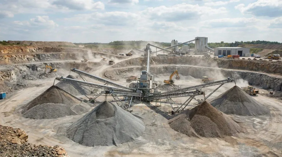 Modern quarry with conveyor systems and stockpiled materials