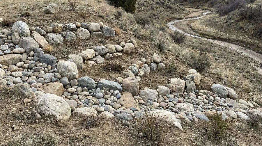 River rocks arranged on a landscape slope for erosion control