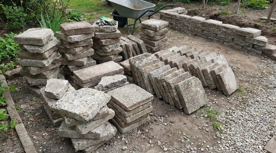 Broken concrete pieces arranged for repurposing projects