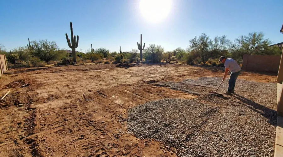 Step-by-step installation process showing landscape fabric installation, base preparation, and rock placement in an Arizona backyard
