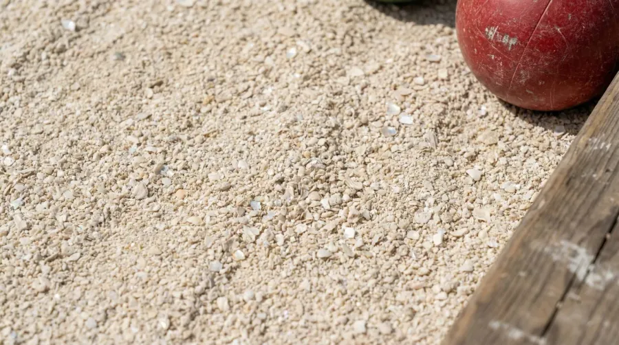 Oyster shell bocce court surface showing fine crushed shell texture