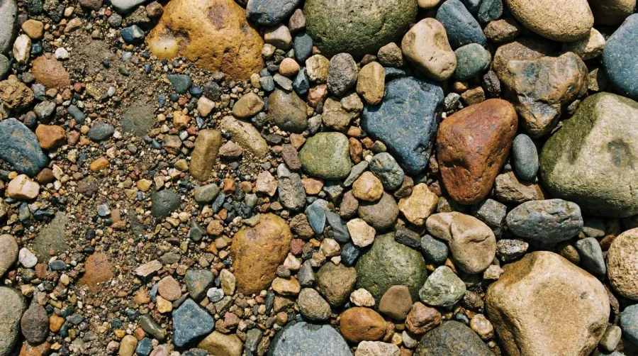 Close-up of bank run gravel showing size variation from fine particles to large rocks