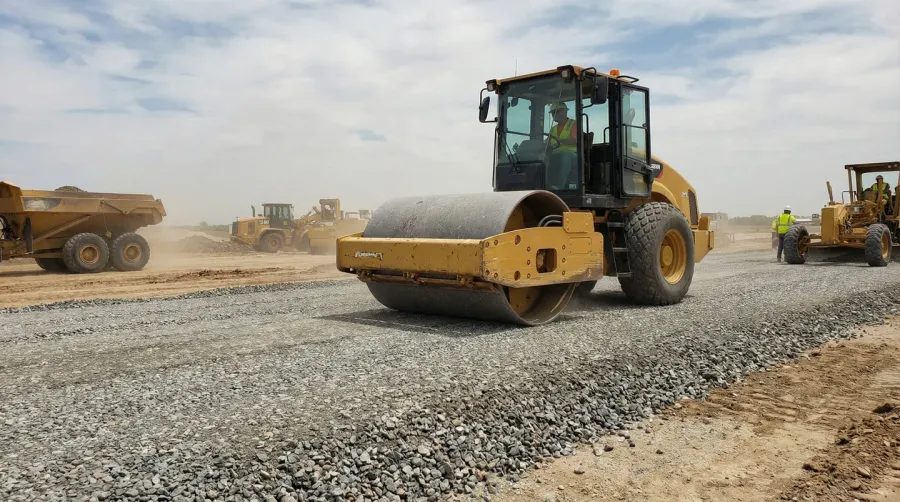 Road base installation with compaction construction equipment