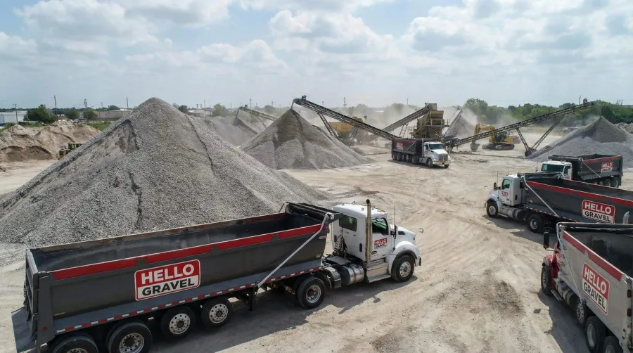 Channelview yard facility with crushed concrete piles and Hello Gravel trucks