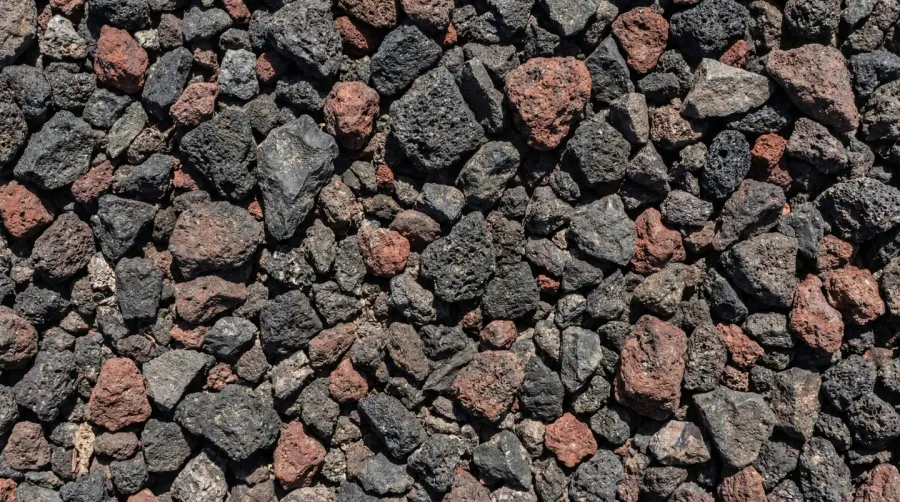 Close-up texture of crushed lava rock with angular pieces for driveway