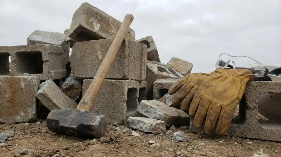 concrete blocks with sledgehammer and safety equipment