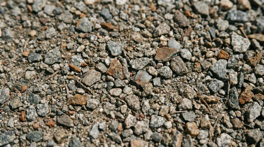 Close-up view of gravel screenings texture showing crushed stone particles