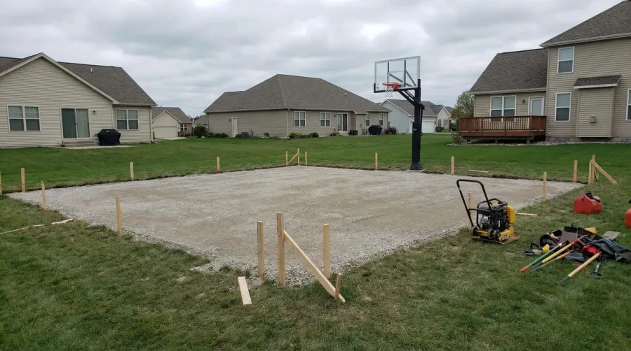 Finished gravel base basketball court with surface installation