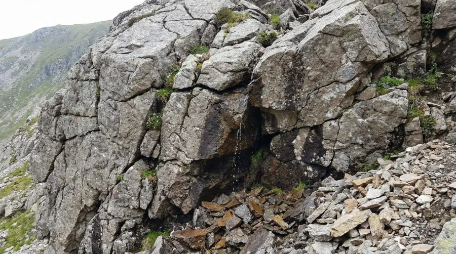 Geological weathering and erosion process showing rock breakdown