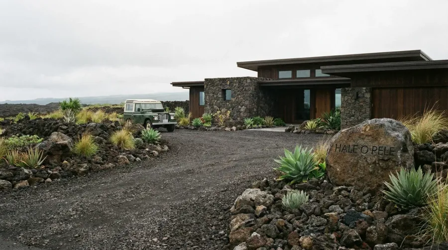 Lava rock driveway with dark volcanic stone at residential home