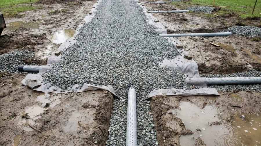 Crushed stone gravel wet area drainage installation