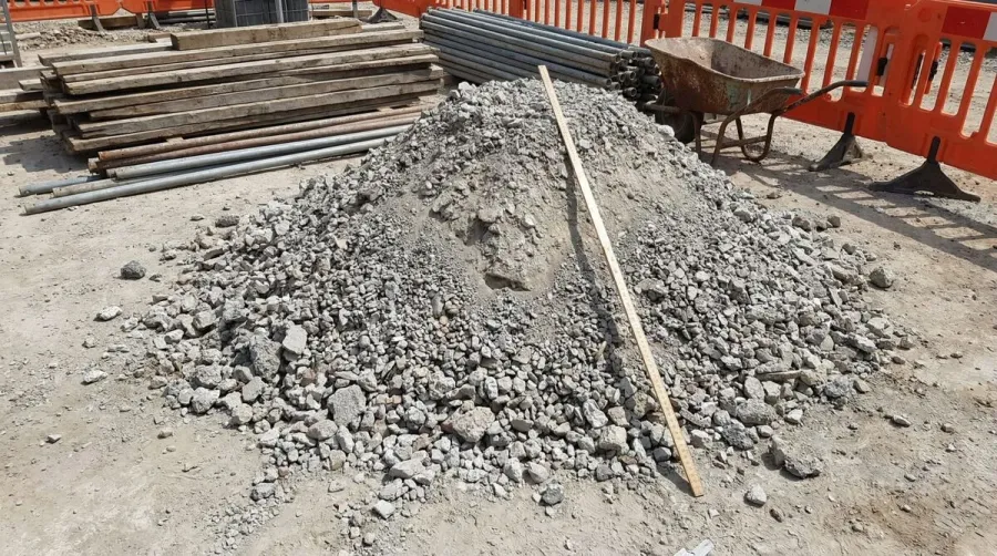 Crushed concrete pile with measuring yard marker