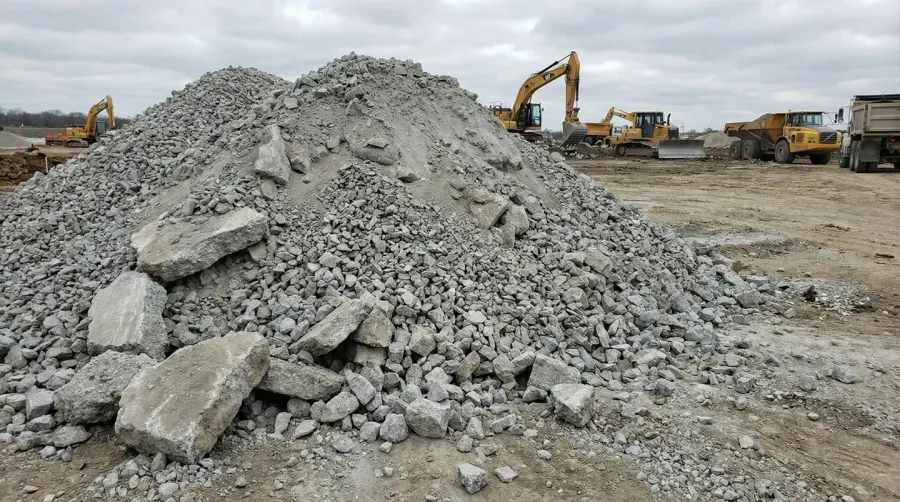 Crushed concrete road base material pile at construction site