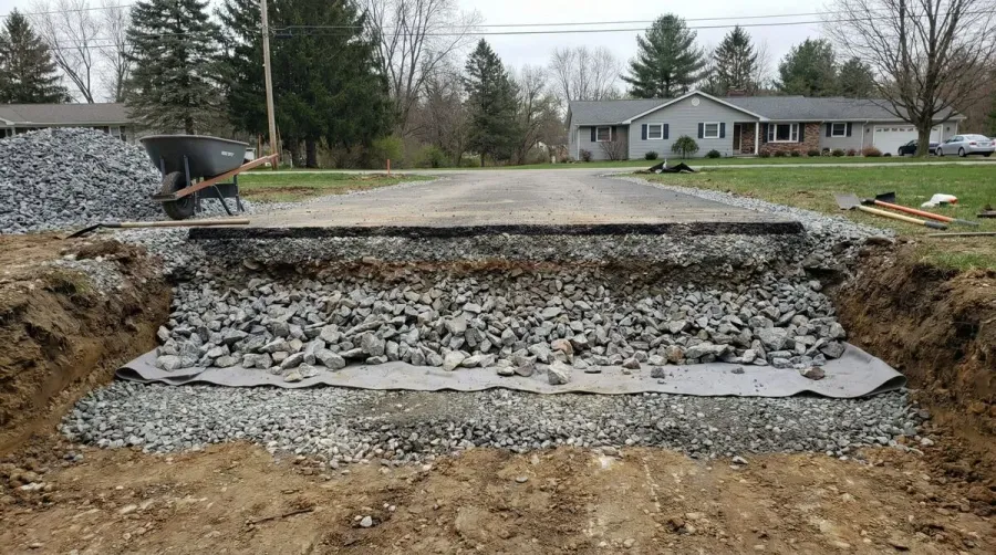 Professional Driveway With Proper Rock Base Foundation Showing Layers