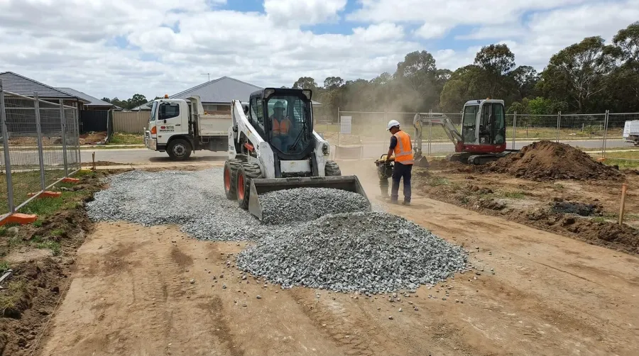 Construction project showing crushed concrete application on driveway