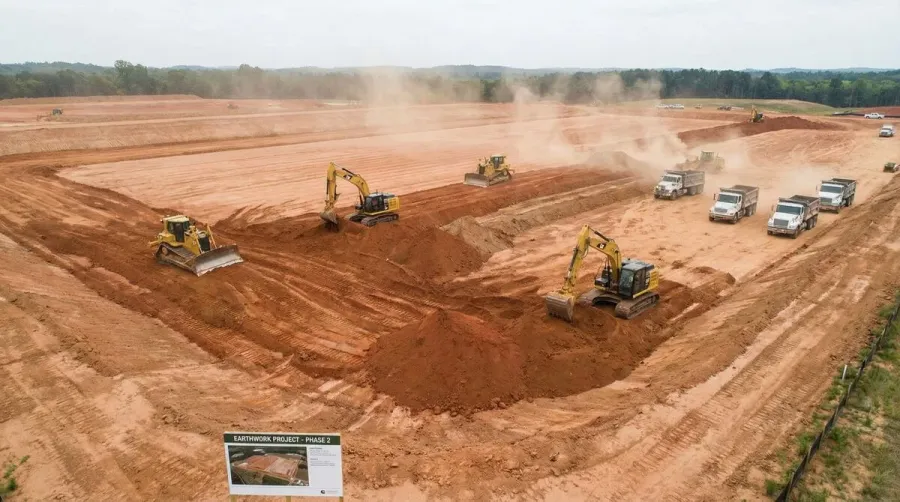Construction site with structural fill dirt being placed