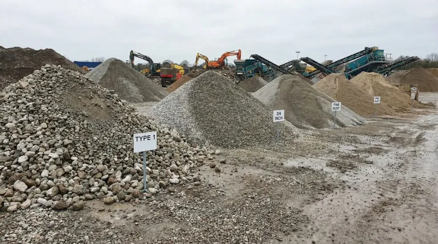 sorted piles of crushed concrete in different sizes
